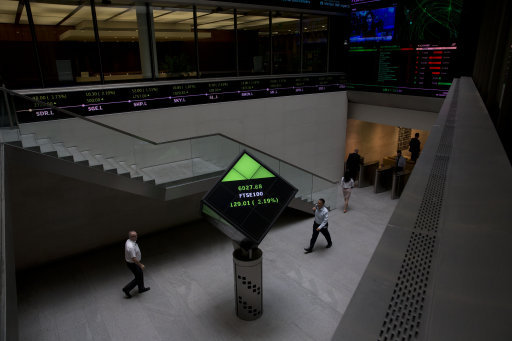 Financial information displayed nside the London Stock Exchange. Picture: AP Photo/Matt Dunham